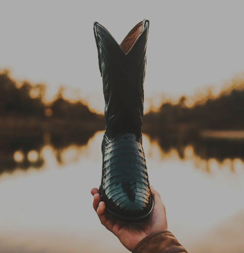 The Effortless Luxury of Exotic Leathers on a sun set over water