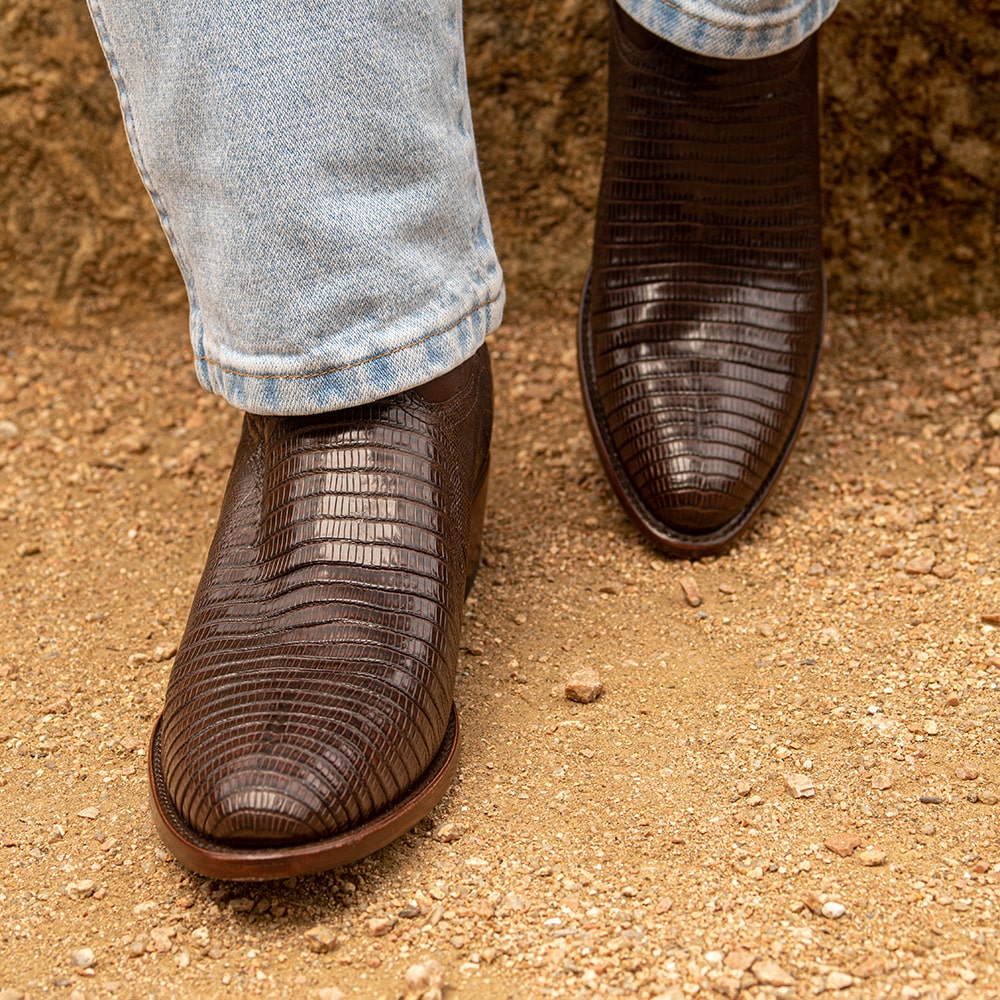 Man wearing brown RUJO Teju Lizard cowboy boots